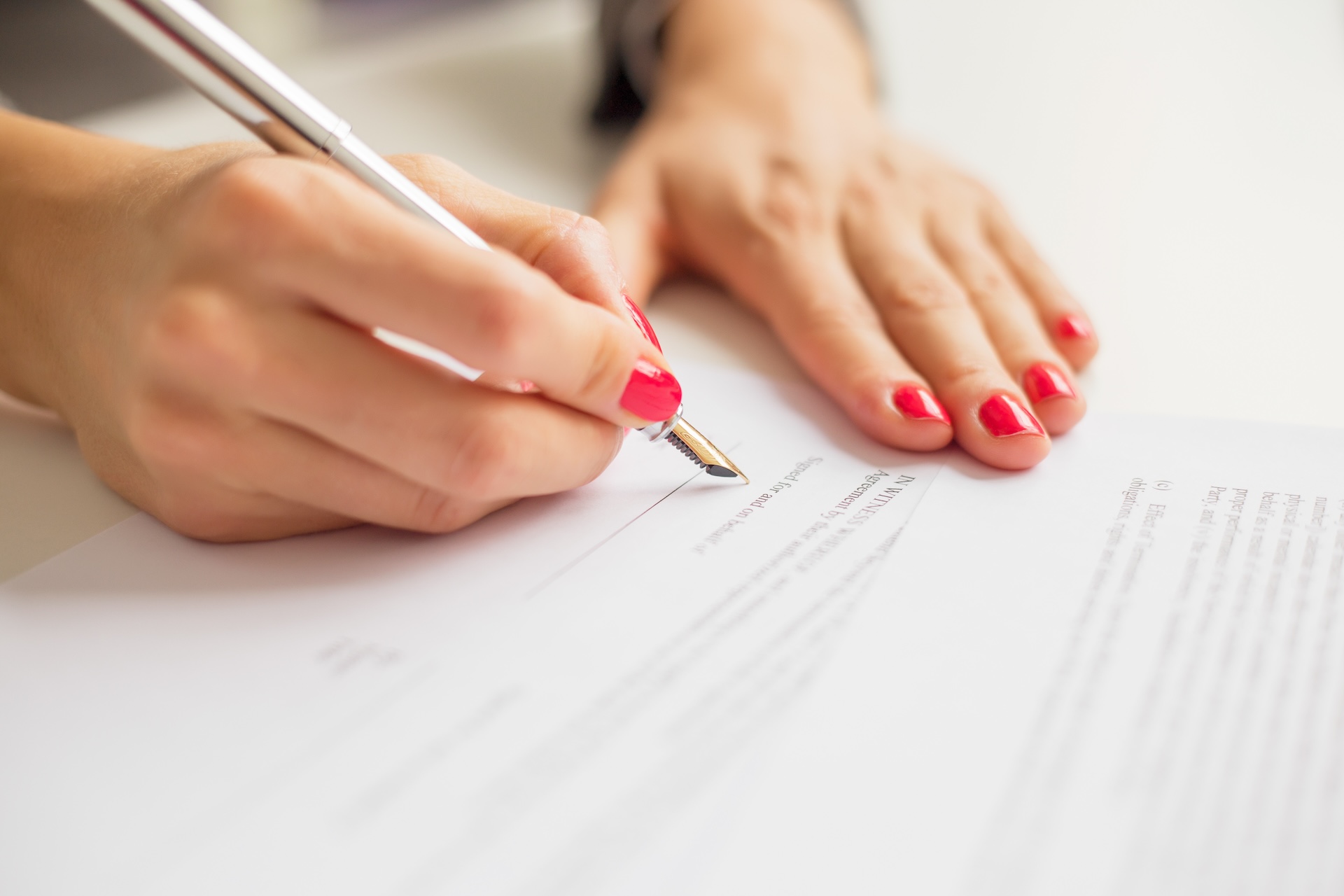 Female writing on paper